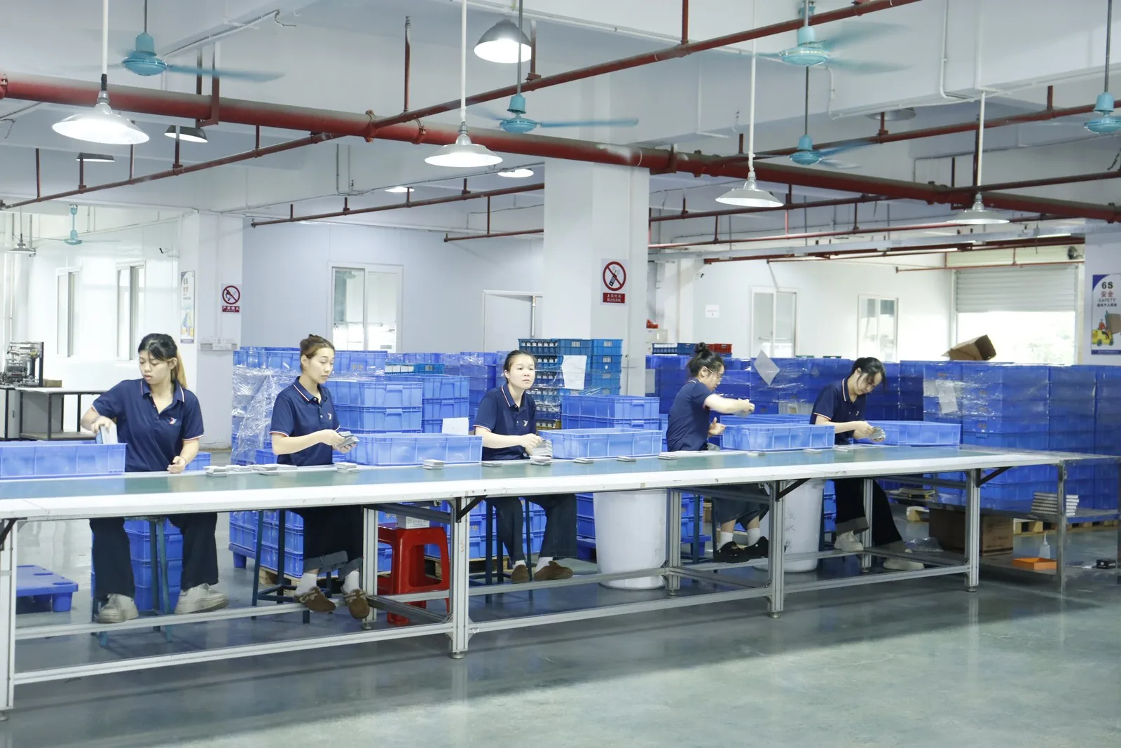 Assembly floor — card sets packed and checked by hand